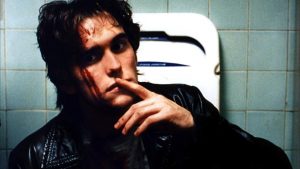 still from the film showing title character in a bathroom with blood on his face